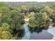 Scenic aerial view of a natural spring and lush surroundings at 8869 Sw 194Th Ct, Dunnellon, FL 34432