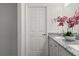 Bathroom featuring granite countertops, dual sinks, and contemporary fixtures at 10 Sequoia Trail Ter, Ocklawaha, FL 32179