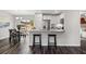 Open-concept kitchen and dining area featuring stainless steel appliances and modern finishes at 10 Sequoia Trail Ter, Ocklawaha, FL 32179
