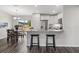 Bright kitchen and dining area featuring granite counters, appliances and bar seating at 10 Sequoia Trail Ter, Ocklawaha, FL 32179