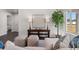 Cozy living room with stylish decor, comfortable seating, and view to hall and outside at 10 Sequoia Trail Ter, Ocklawaha, FL 32179