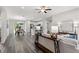 Spacious living room showcasing an open floor plan connecting to the dining and kitchen areas at 10 Sequoia Trail Ter, Ocklawaha, FL 32179