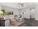 Bright living room featuring neutral walls, modern flooring, comfortable seating, and a ceiling fan at 10 Sequoia Trail Ter, Ocklawaha, FL 32179