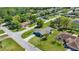 Aerial view of a single-Gathering home nestled in a neighborhood with lush greenery and tree-lined streets at 10690 Se 44Th Ter, Belleview, FL 34420
