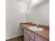 Bathroom with a new vanity, mirror, and fixtures at 10690 Se 44Th Ter, Belleview, FL 34420