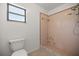 Bathroom with a shower stall and a tiled floor at 10690 Se 44Th Ter, Belleview, FL 34420