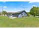 Charming single-story home featuring a well-maintained lawn and mature landscaping at 10690 Se 44Th Ter, Belleview, FL 34420