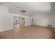 Spacious living room boasts hardwood floors and natural light, with an adjacent kitchen view at 10690 Se 44Th Ter, Belleview, FL 34420