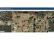 Aerial view of the property showcasing the expansive land and wooded areas at 10750 Nw 7Th St, Ocala, FL 34482
