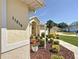 Well-maintained front yard featuring mature landscaping and a clearly visible house number at 11010 Se 174Th Loop, Summerfield, FL 34491