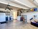 Well-lit garage provides functionality and storage with laundry area and utility sink, offering convenience and practicality at 11010 Se 174Th Loop, Summerfield, FL 34491