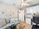 Inviting living area with comfortable seating, built-in cabinets, and a convenient desk space at 11010 Se 174Th Loop, Summerfield, FL 34491