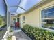 Enclosed patio extends living space outdoors and overlooks mature landscaping, offering a tranquil space to unwind and relax at 11010 Se 174Th Loop, Summerfield, FL 34491