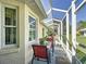 Enclosed patio area perfect for outdoor dining and relaxation, featuring a table and chairs at 11010 Se 174Th Loop, Summerfield, FL 34491