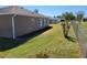 Spacious backyard featuring well-maintained grass and freshly mulched landscaping around the house at 11395 Sw 139Th St, Dunnellon, FL 34432