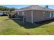Fenced backyard offers privacy and space for outdoor enjoyment, enhanced by fresh mulch beds at 11395 Sw 139Th St, Dunnellon, FL 34432