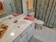 Bathroom featuring a toilet, shower with curtain, and sink with mirror at 11395 Sw 139Th St, Dunnellon, FL 34432