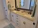 Bright bathroom featuring double sinks, a framed mirror, and granite countertops at 11395 Sw 139Th St, Dunnellon, FL 34432