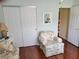 Bedroom features a closet, comfortable chair, and plenty of natural light at 11395 Sw 139Th St, Dunnellon, FL 34432