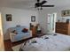 Bright, open bedroom with a ceiling fan and hardwood flooring at 11395 Sw 139Th St, Dunnellon, FL 34432