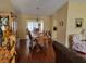 Inviting dining room featuring a wooden table, chairs, and unique dolphin sculpture at 11395 Sw 139Th St, Dunnellon, FL 34432