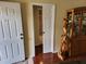 Entryway with coat closet, display cabinet, and doorway with sliding door at 11395 Sw 139Th St, Dunnellon, FL 34432