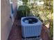Exterior HVAC unit surrounded by mulch landscaping near the side of the home at 11395 Sw 139Th St, Dunnellon, FL 34432