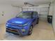 Spacious garage featuring a bright blue Kia Soul at 11395 Sw 139Th St, Dunnellon, FL 34432