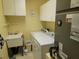 Well-lit laundry room with updated appliances and ample storage at 11395 Sw 139Th St, Dunnellon, FL 34432