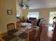 Open-concept living area blending dining and living spaces with comfortable seating at 11395 Sw 139Th St, Dunnellon, FL 34432