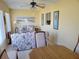 Bright living room with floral sofas and a view to the kitchen at 11395 Sw 139Th St, Dunnellon, FL 34432