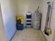 Well-organized storage space with water heater and shelves at 11395 Sw 139Th St, Dunnellon, FL 34432