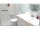 Bathroom features a stand-up shower, toilet, vanity, and a mirror at 13780 Sw 111Th Ave, Dunnellon, FL 34432