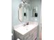 Bathroom vanity featuring a bright sink, updated fixtures, and two mirrors at 13780 Sw 111Th Ave, Dunnellon, FL 34432