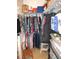Walk-in closet provides ample space for storage with custom shelving at 13780 Sw 111Th Ave, Dunnellon, FL 34432