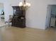 Cozy dining area features hardwood floors, chandelier, and convenient kitchen access at 13780 Sw 111Th Ave, Dunnellon, FL 34432