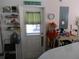 Garage exterior access door with organizers and work table at 13780 Sw 111Th Ave, Dunnellon, FL 34432