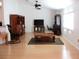 Open concept living room featuring hardwood floors, ceiling fan, and ample natural light at 13780 Sw 111Th Ave, Dunnellon, FL 34432