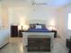 This main bedroom includes neutral paint, tile floor and a comfortable layout at 13780 Sw 111Th Ave, Dunnellon, FL 34432