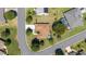 Aerial view of home with pool and patio, lush lawn, and mature trees, and nice landscaping at 13805 Se 87Th Ter, Summerfield, FL 34491
