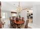 Open-concept dining area with adjacent kitchen and living room, perfect for entertaining and Gathering living at 13805 Se 87Th Ter, Summerfield, FL 34491