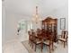 Traditional dining room with an elegant chandelier and a dining table, perfect for gatherings and formal dinners at 13805 Se 87Th Ter, Summerfield, FL 34491