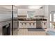 Well lit kitchen featuring stainless appliances, white cabinetry, and neutral countertops and backsplash at 13805 Se 87Th Ter, Summerfield, FL 34491
