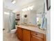 Bathroom featuring a large mirror, and a shower/tub combo at 1689 Van Buren Way, The Villages, FL 32162