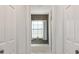 Bathroom features a tiled shower and tub combo and a window at 17472 Se 112Th Ct, Summerfield, FL 34491