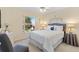 Well-lit bedroom showcasing a large window and calming decor at 17472 Se 112Th Ct, Summerfield, FL 34491