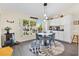 Bright dining nook with white cabinets and a large window offering natural light and a view of the outdoors at 17472 Se 112Th Ct, Summerfield, FL 34491