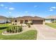 Charming single-story home with a well-manicured lawn and a two-car garage in a desirable neighborhood at 17472 Se 112Th Ct, Summerfield, FL 34491
