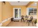 Cozy front porch features a seating area and decorative details that add to the home's curb appeal at 17472 Se 112Th Ct, Summerfield, FL 34491