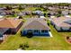Aerial view of a home featuring an enclosed lanai and backyard surrounded by lush green grass at 1813 Sw 157Th Place Rd, Ocala, FL 34473